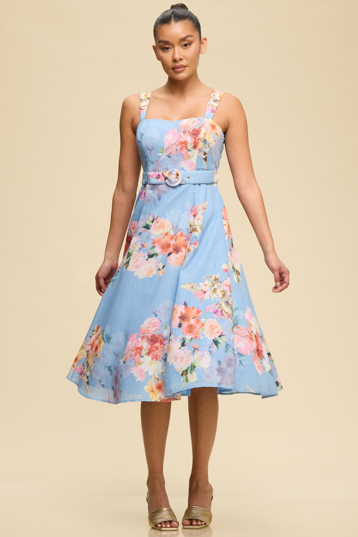 Woman wearing a floral dress on a beige background