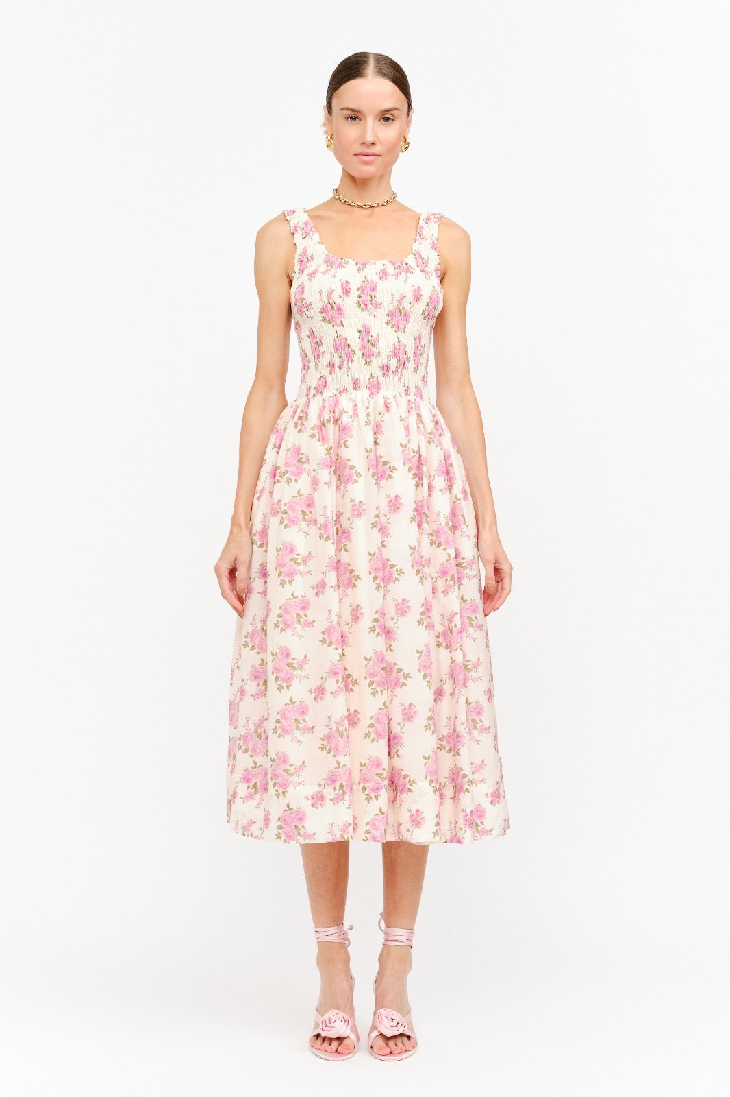 Woman wearing a floral dress on a white background