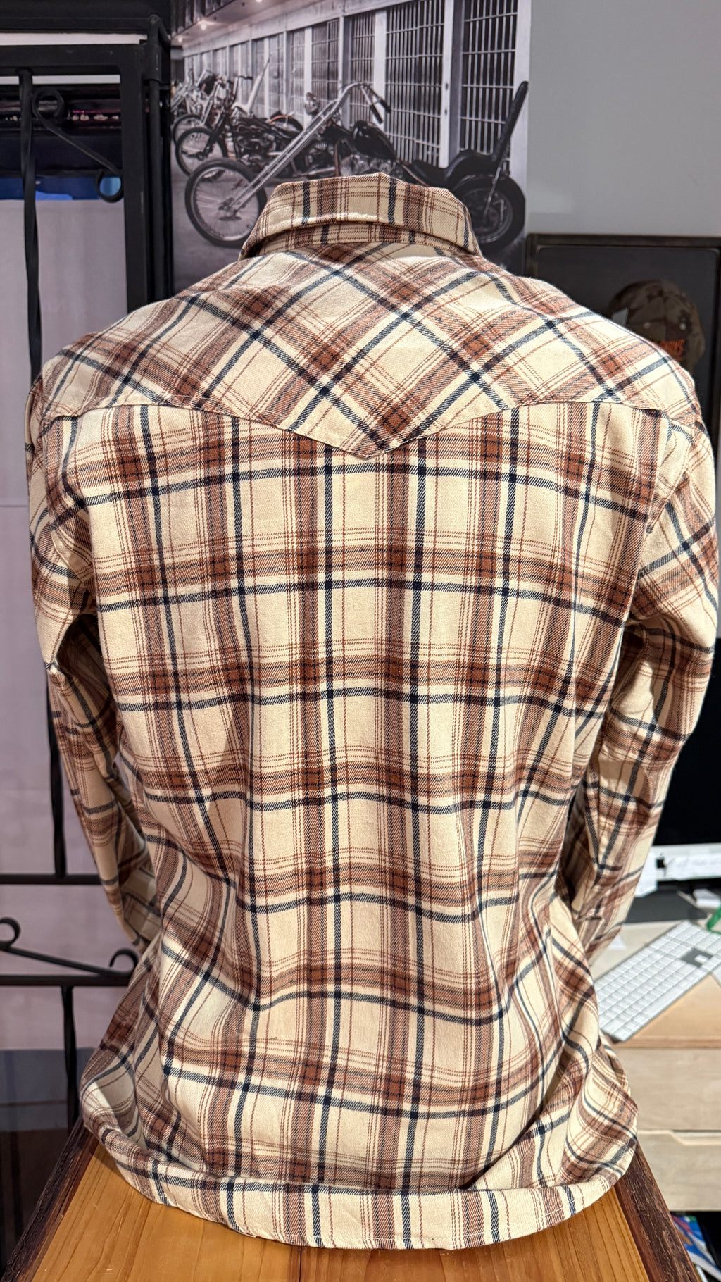 Plaid shirt on a mannequin with a blurred background